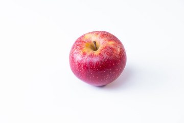 top view red apple on white background. top view red apple on white background. An apple with a bright skin on a base of yellowish color