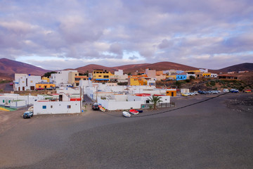 Fototapeta na wymiar View on Ajuy with colorful houses and fishing boats on Fuerteventura, Spain.