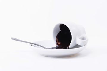 Dark chocolate melted on white hot Cup, a little spoon. Close up