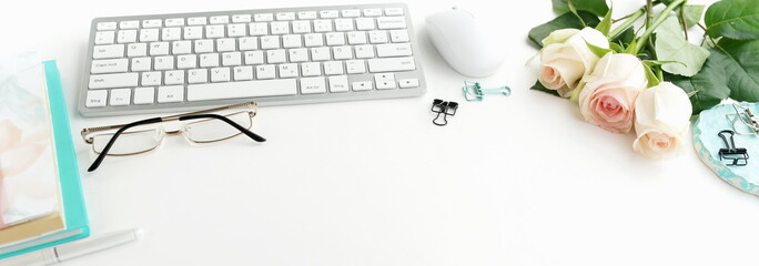 Banner women's office desk. Female workspace with laptop,  flowers pink roses,  accessories,...