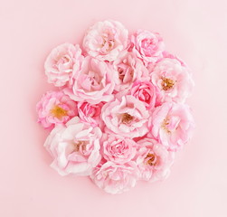 Flowers composition background. beautiful pale pink roses bouquet on pale pink background.Top view.Copy space