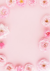 Flowers composition background. beautiful pale pink roses on pale pink    background.Top view.Copy space
