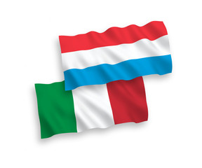 National vector fabric wave flags of Italy and Luxembourg isolated on white background. 1 to 2 proportion.