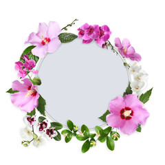 Frame made of beautiful tropical leaves and flowers on white background, top view. Space for text