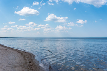 Fototapeta na wymiar Cloudscape over a Beach at the Baltic Sea Coast in Latvia