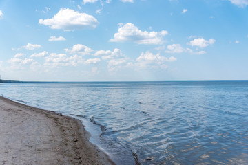 Fototapeta na wymiar Cloudscape over a Beach at the Baltic Sea Coast in Latvia
