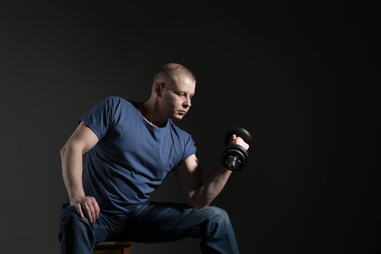 a man in blue jeens and t-shirt