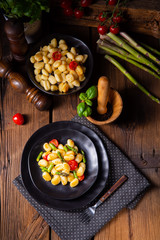 crispy gnocchi with roasted asparagus and tomatoes
