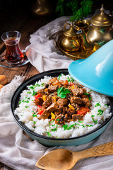 Tajin beef stew with rice paprika and sesame seeds