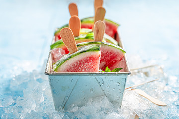 Cold ice cream made of watermelon on a stick