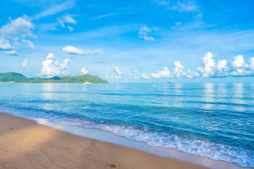 Beautiful tropical beach sea ocean with white cloud blue sky and copyspace