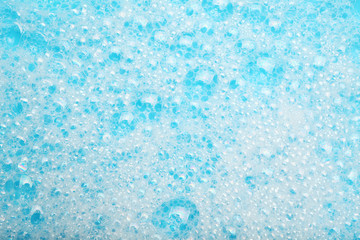 Background soap suds (foam) and bubbles from detergent. House cleaning concept.