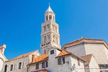 Fototapeta na wymiar Morning in Split, Croatia, sunrise over old town houses and tower of cathedral in roman emperor Diocletian palace
