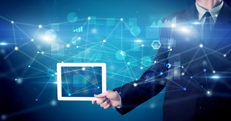 Elegant hand holding tablet with virtual database and network concept
