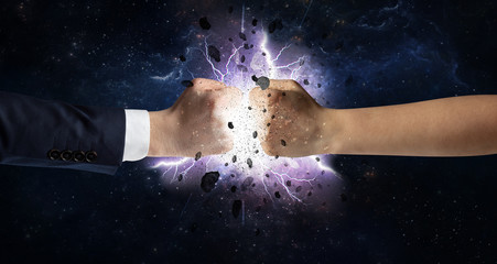 Naklejka na ściany i meble Two hands fighting with storm explosion concept 