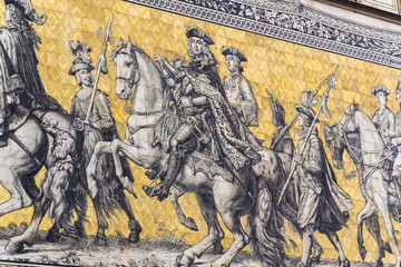 Public street view of the largest porcelain artwork in the world Furstenzug - Procession of Princess in Dresden, Germany, mural of a mounted procession of Saxony rulers © josefkubes
