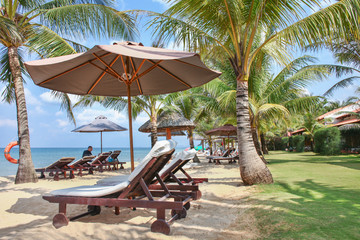 Relaxation area watching the sea at resort on the beach in Phu Quoc island in Vietnam. Blue sky. Beautifull sunny