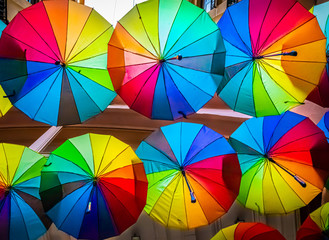 Colorful umbrellas in the sky of the Victoria Passage, in Bucharest city centre, Romania