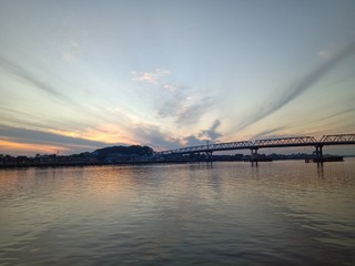 Fototapeta premium the sky when the sun will rise in the river with the bridge
