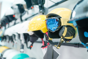 Rows of ski and snowboarding helmets closeup