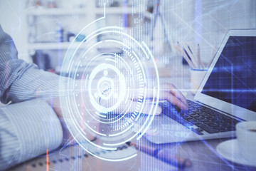 Obraz premium Businessman working on Laptop with technology theme drawing. Concept of big data. Double exposure.