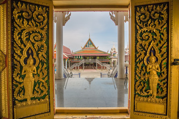 Carving art on the doors of Thai temple in Wat Bang Pla - Samut Sakhon, Thailand