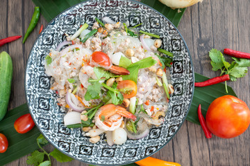 Glass Noodle,Pork,Nut Spicy Salad.(Yum Woon Sen) Traditional Thai food on cooking table background