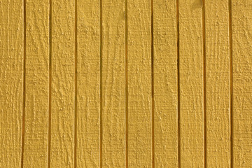 Abstract background image of yellow painted wooden building exterior surface
