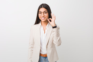 Young business arab woman isolated against a white background cheerful and confident showing ok...