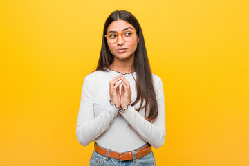 Young pretty arab woman against a yellow background making up plan in mind, setting up an idea.