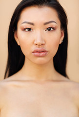 Fototapeta na wymiar Beautiful asian model with long dark hair