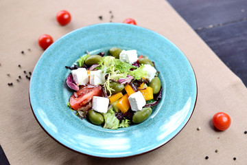 Greek salad. Salad with feta cheese, olives, cherry tomatoes and bell peppers