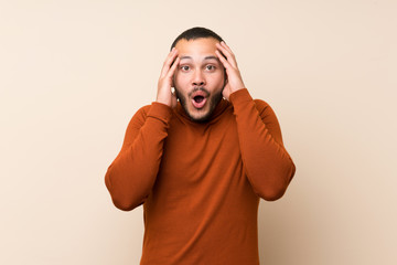 Colombian man with turtleneck sweater with surprise expression