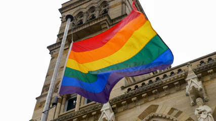 LGBT flag over Northampton Guildhall building on Pride Festival Weekend in UK