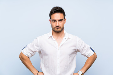 Fototapeta premium Handsome young man over isolated blue background angry