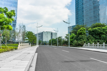 city road through modern buildings in suzhou