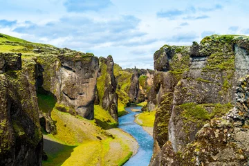 Foto auf Leinwand Iceland canyon fjaðrárgljúfur with river flowing through it © mehdivir