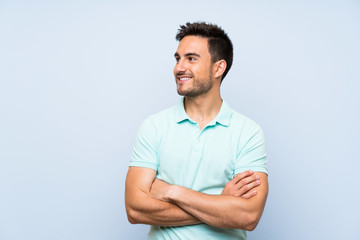 Obraz premium Handsome young man over isolated background happy and smiling