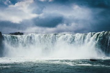 Godafoss waterfall in Iceland with cloudy sky