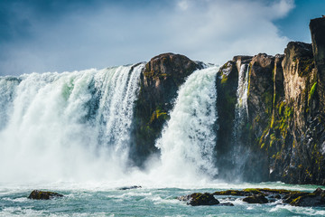 Godafoss waterfall in Iceland with cloudy sky