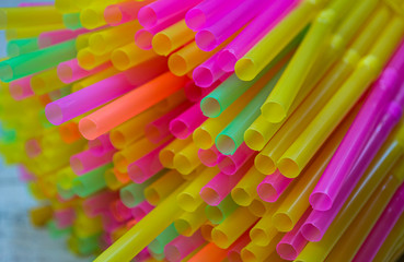 Colorful plastic straws drinking background