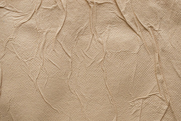 Crumpled brown recycle tissue paper texture abstract background