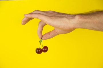 Ripe, red cherry on a wooden table
