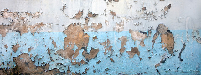 Close up old peeled grunge style wall detail of concrete building exterior