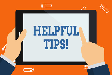 Word writing text Helpful Tips. Business photo showcasing advices given to be helpful knowledge in life Hand Holding Pointing Touching Blank Rectangular Color Tablet White Screen