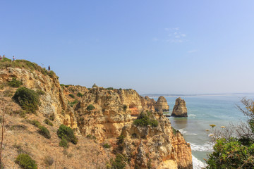 Beautiful golden cliffs and emerald water in Ponta da Piedade, Lagos, Algarve, Portugal