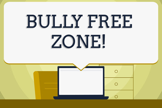 Conceptual hand writing showing Bully Free Zone. Concept meaning creating abuse free school college life Blank Huge Speech Bubble Pointing to the White Laptop Screen