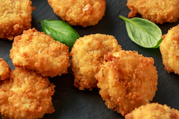 Fried Mac, macaroni and Cheese Bites in breadcrumbs with ketchup sauce