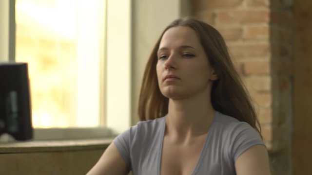 Slow Motion Woman Working Out On Rowing Machine At The Gym