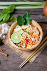 Close-up shot Instant noodles with lemon shrimp chilli hot and spicy on old wooden table select focus shallow depth of field